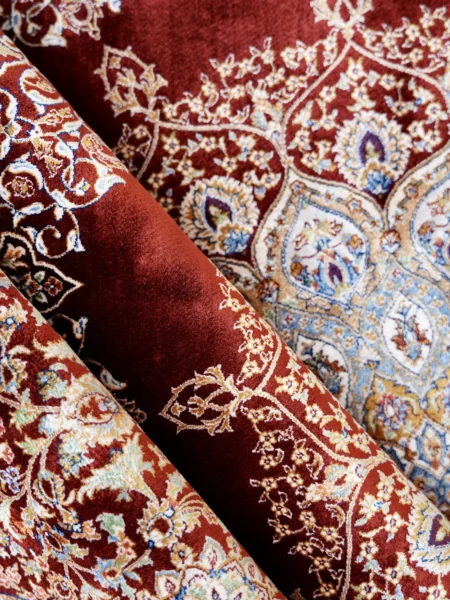 Grand Rosette Medallion Rug in Red, machine-woven herbal-silk rug — soft fold showing the pile and medallion detail